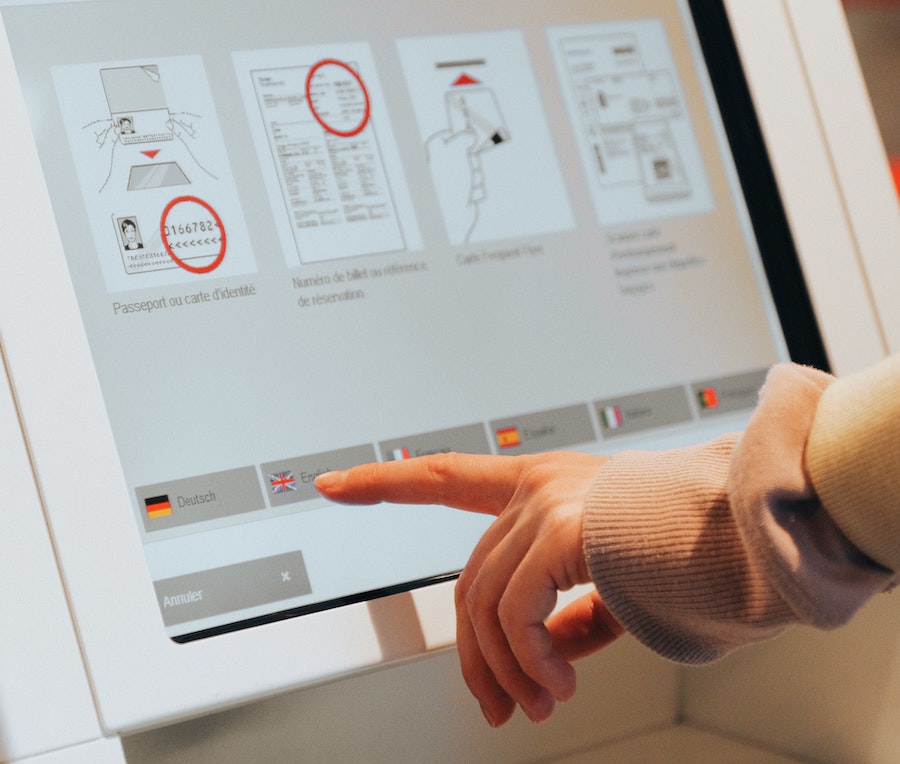 person using touch screen on smart digital signage system